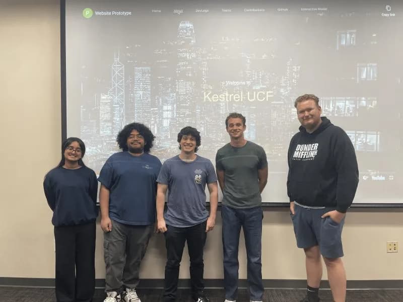 Five Kestrel team leads standing in front of a projected Kestrel UCF website prototype.